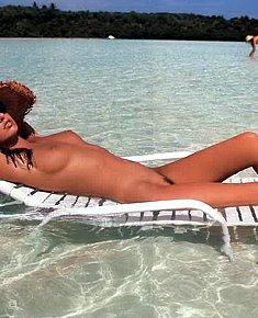 lazy skinny tiny tits teeny girls sunbathes on the beach near the sea - Tiny tits