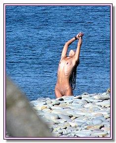 stripped nudist chicks discards briefs on the beach in Kazantip