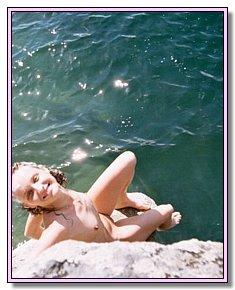 stripped blonds and brunet girls catch admiring glances on the beach holidays