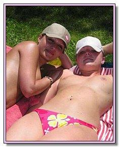 lovely pretty fem nude admires itself on the nude beach