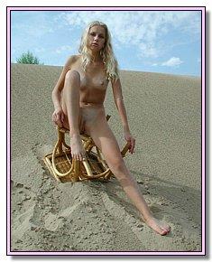 diffident female nude chicks spreads legs at the nudist beach resort