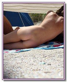 bashful fem youth takes sun-bath on the beaches of Crimea