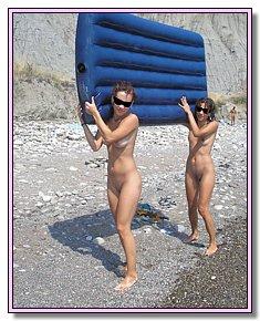 undressed naked girls takes off  their panties on a nudist beach