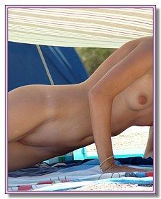 undressed blonds and brunet girls enjoys nudist life at European beach