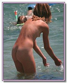 cute yong nudies flirts naked on the nude beach