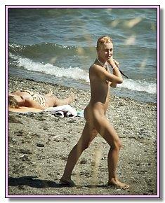 beautiful bitches admires itself against a sea background