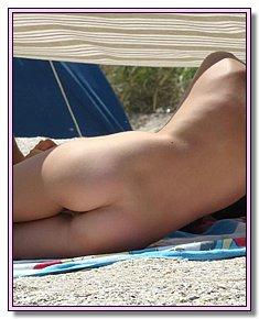 shapely exhibitionist teens completely undresses at a local beach