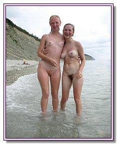 cheerful female nudists remains naked FKK beach
