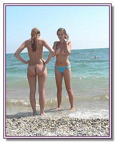 without complexes beautifull naked babes warms naked vagina in the sun on the beach holidays