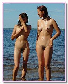 shameless pretty babes flirts with nudist men In the company of nudists on the beach