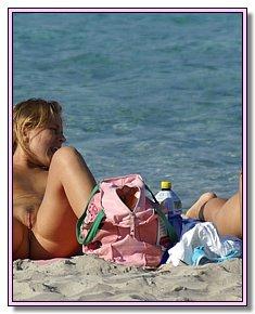 shapely various teenage girls sunbathes without panties among nudists