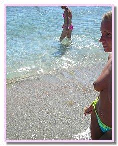 undressed teeny girls flirts naked on a nudist beach