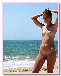 obscene pretty fem nude lie sunbathing naked by the sea