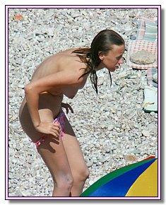 bare cute nudists catch admiring glances on a sandy beach