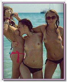 tanned good-looking girls takes off  their panties among nudists