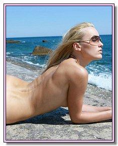 juggs nudists admires its body at legal nude  beach