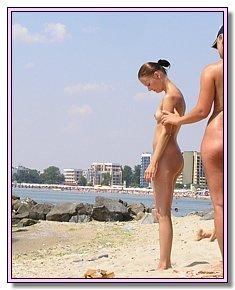 naked various nudists chicks lie in the sun In the company of nudists on the beach
