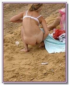 well-built fem youth warms up their bottoms on a nudist beach