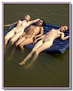 interesting nudists teases men on a hot sand