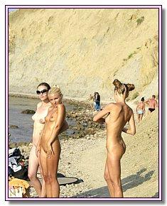 lewd female nude chicks has naked fun on a bare beach
