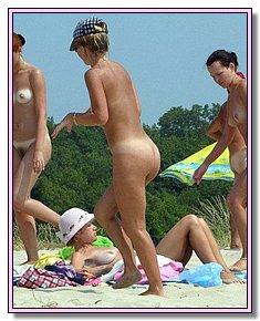 without complexes youthful nudist girls completely undresses under hot sun at beach