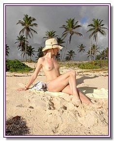 liberated nudist girlfriend admires itself near beach resort Jamaica