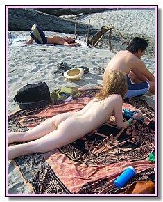 lewd blonds and brunet girls tans In the company of nudists on the beach