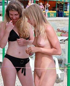 With bald pussy teeny nudists sunbathes fully naked on the beaches of Europe