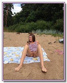 relaxed blonds and brunet girls has naked fun on a wild beach
