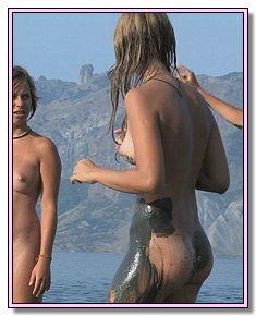 adorable nudists attracts men on a hot sand