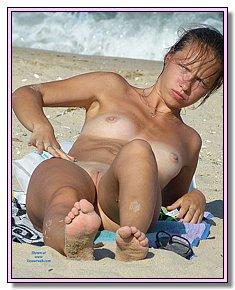 beautiful various teenage girls sunbathes without bikini at a local beach