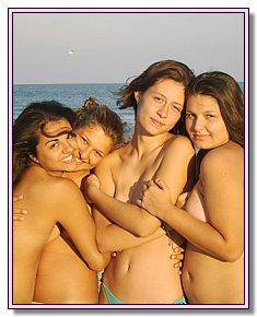 comely various teenage girls warms naked vagina in the sun
