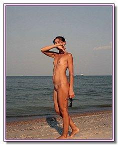 lazy nudist babes sunbathes naked on a nudist beach