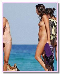 charming naked babes warms naked vagina in the sun