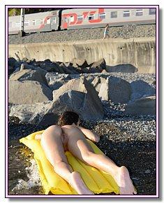 naked sexiest girls relaxes without clothes among nudists