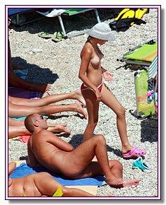 weary heat exhibitionist teens warms naked vagina in the sun at legal nude  beach