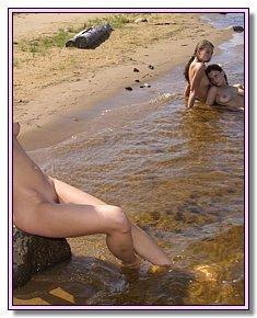  various nudists chicks sunbathes fully naked at legal nude  beach