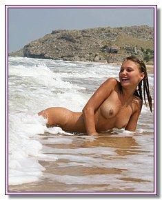 sexy blonds and brunet girls catch admiring glances on a nudist beach