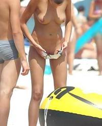 Pretty chicks are uncovering unsheathed on beach and..