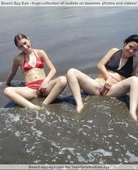 Hot  babes are posing naked on beach and showing..